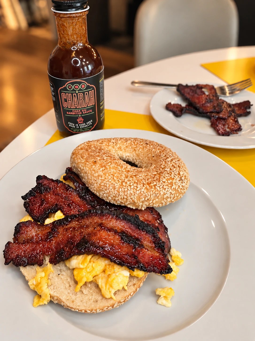 Char siu candied bacon on an egg and bagel sandwich